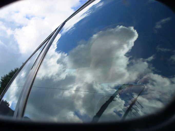 self-portrait in car mirror